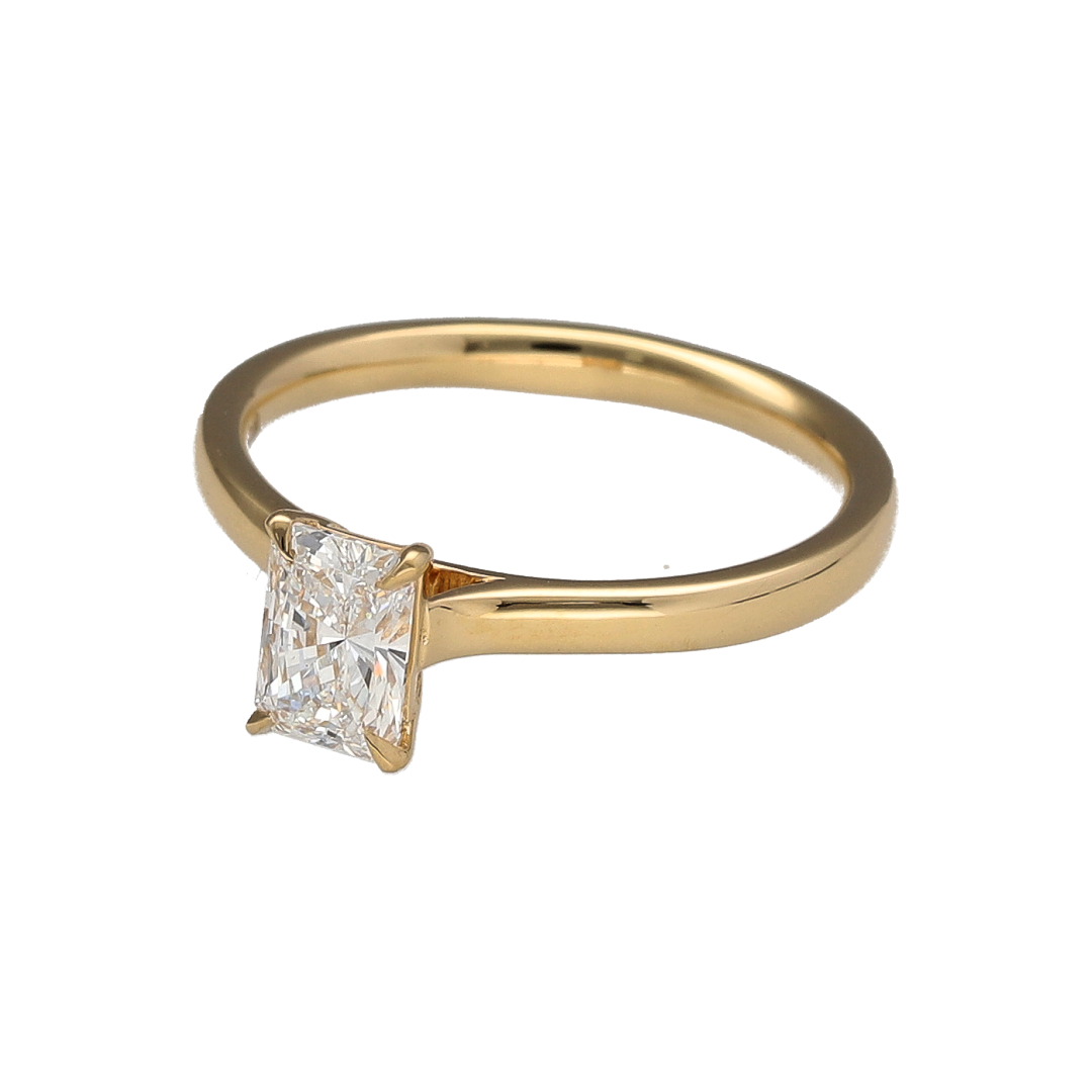 Add refined elegance and striking brilliance to your jewellery collection with this pre-owned 18ct yellow gold diamond solitaire ring, featuring a sophisticated emerald-cut centre stone—perfect for special occasions or timeless everyday luxury.

Design: The ring showcases an emerald-cut diamond of approximately 0.60ct, offering clean lines and a distinctive step-cut sparkle with a beautifully understated yet eye-catching appearance.