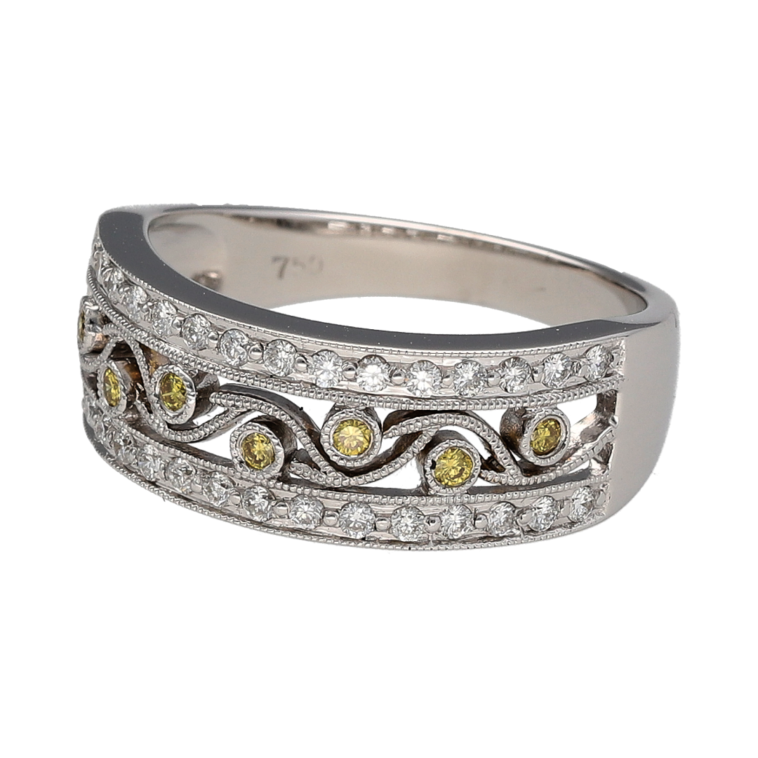 Add striking contrast and intricate detail to your collection with this pre-owned 18ct white gold white and yellow diamond set open band ring—an eye-catching piece with luxurious appeal.

Design: The ring features an 8mm wide open band front, crafted in a delicate filigree style pattern and set with a mix of white and yellow round diamonds, creating a beautifully detailed and textured look.