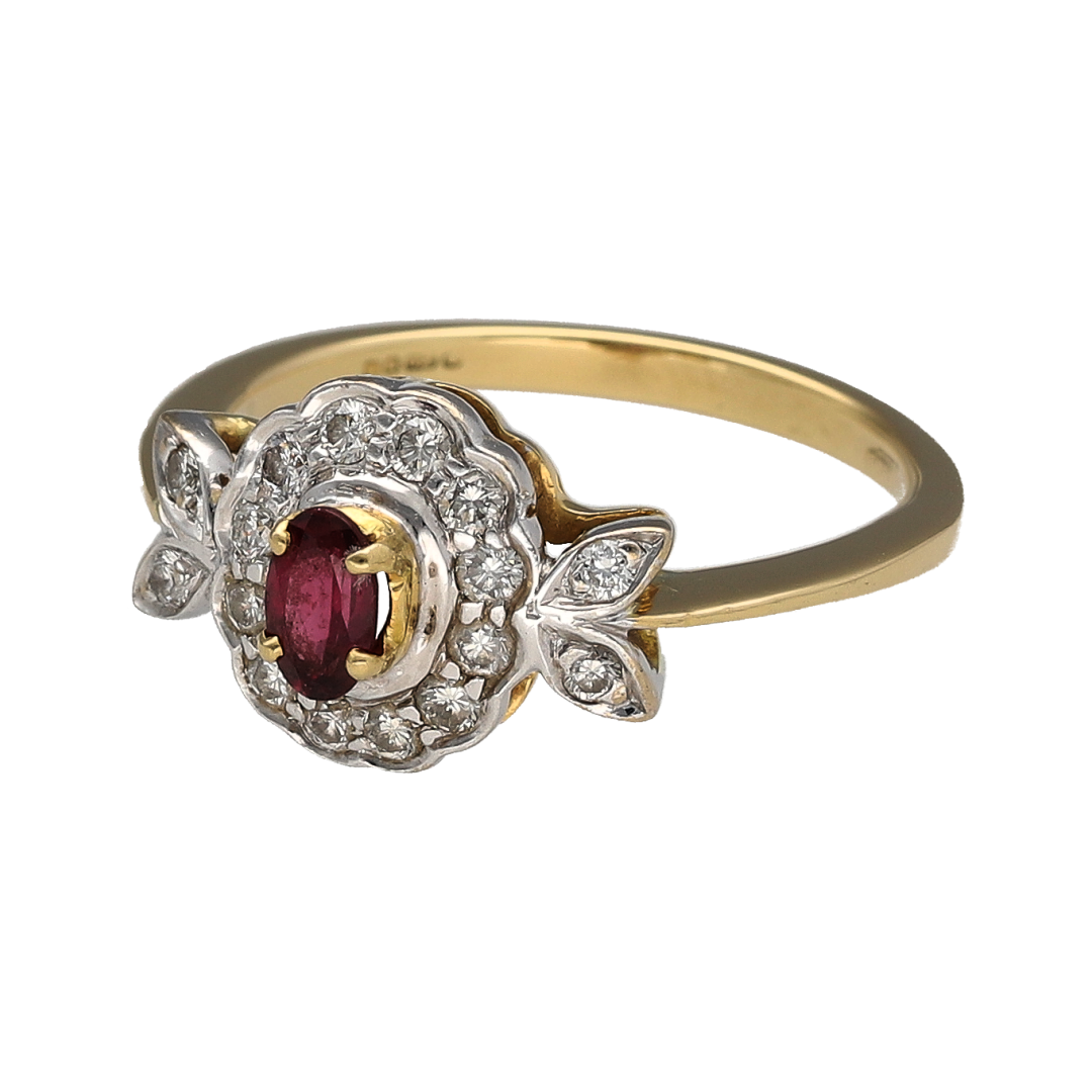 Add timeless elegance and rich colour to your collection with this pre-owned 18ct yellow gold diamond and ruby set cluster ring—an eye-catching piece with classic appeal.

Design: The ring features a 5mm by 3mm oval ruby at the centre, surrounded by a cluster of sparkling diamonds that enhance its deep red tone and create a bright, elegant focal point.