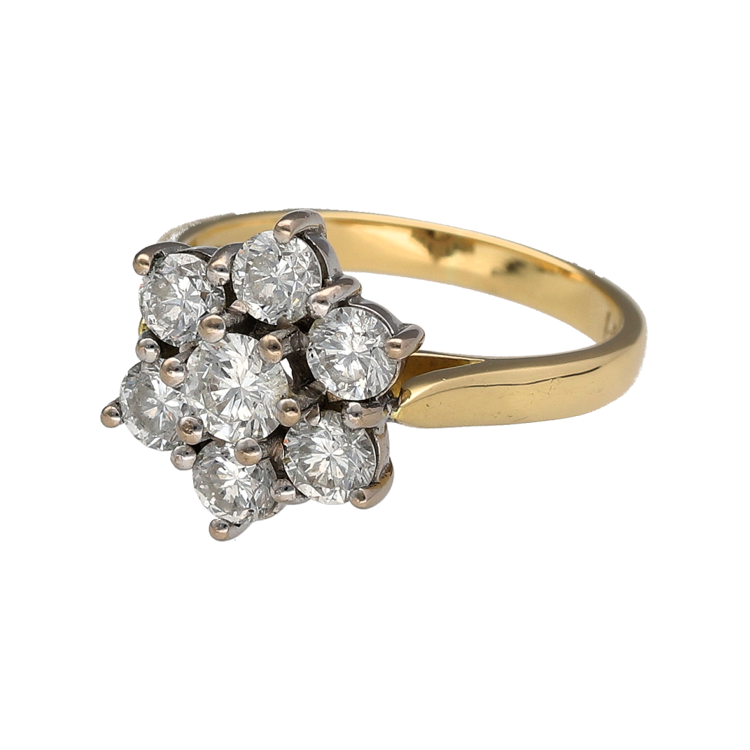 Bring exceptional sparkle and timeless elegance to your collection with this pre-owned 18ct yellow gold diamond flower cluster ring, featuring a luxurious design with impressive brilliance—perfect for special occasions or standout evening wear.

Design: The ring showcases a flower-inspired cluster arrangement of sparkling diamonds, creating a bold and eye-catching focal point with classic floral styling.