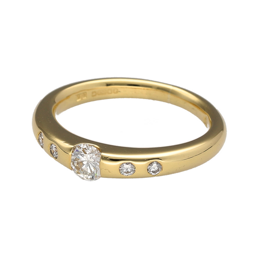 Add timeless elegance and luxurious sparkle to your jewellery collection with this pre-owned 18ct yellow gold diamond set solitaire ring, featuring a classic brilliant cut centre diamond with elegant shoulder detailing—perfect for engagements, anniversaries, or sophisticated everyday wear.

Design: The ring showcases a sparkling brilliant cut centre diamond of approximately 0.25ct, complemented by two additional diamonds set into each shoulder for enhanced brilliance and refined elegance.