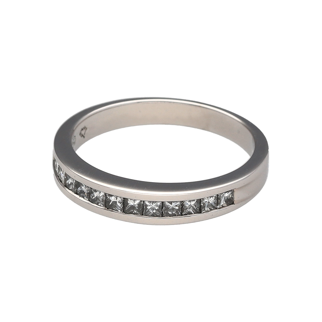 Add timeless sparkle and sophisticated elegance to your jewellery collection with this pre-owned 18ct white gold diamond band ring, featuring a classic channel-set design with luxurious everyday appeal—perfect for anniversaries, weddings, special occasions, or refined daily wear.

Design: The ring features a sleek band design measuring approximately 3mm wide at the front, set with a row of princess cut diamonds in a secure channel setting.