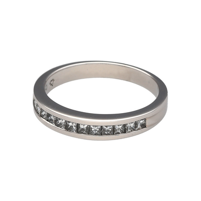 Add timeless sparkle and sophisticated elegance to your jewellery collection with this pre-owned 18ct white gold diamond band ring, featuring a classic channel-set design with luxurious everyday appeal—perfect for anniversaries, weddings, special occasions, or refined daily wear.

Design: The ring features a sleek band design measuring approximately 3mm wide at the front, set with a row of princess cut diamonds in a secure channel setting.