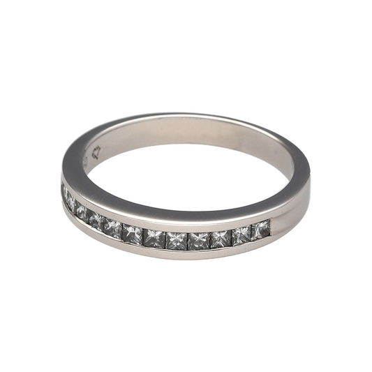 Add timeless sparkle and sophisticated elegance to your jewellery collection with this pre-owned 18ct white gold diamond band ring, featuring a classic channel-set design with luxurious everyday appeal—perfect for anniversaries, weddings, special occasions, or refined daily wear.

Design: The ring features a sleek band design measuring approximately 3mm wide at the front, set with a row of princess cut diamonds in a secure channel setting.