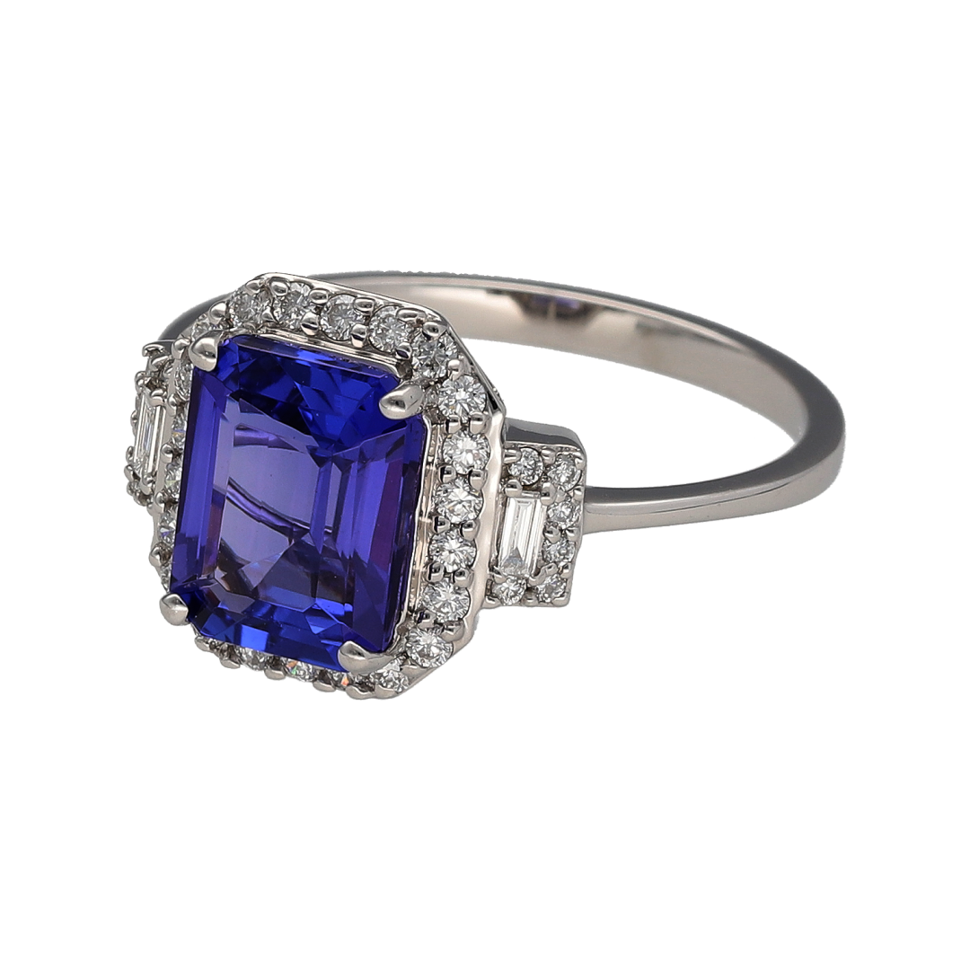 Make a statement with this pre-owned platinum diamond and iolite dress ring, showcasing a captivating centre stone surrounded by dazzling diamonds. Combining luxurious materials with timeless elegance, this striking ring is perfect for special occasions or as a standout addition to any fine jewellery collection.

Design: The ring features an impressive 10mm by 8mm oval-cut iolite, displaying rich violet-blue tones that create a beautiful focal point.