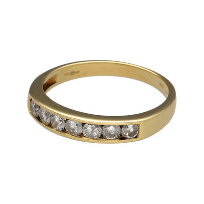 Celebrate timeless elegance and exceptional sparkle with this pre-owned 18ct yellow gold diamond seven stone band ring. Featuring seven brilliant-cut diamonds across the front of the band, this classic design is perfect for everyday luxury, special occasions, or as a meaningful anniversary gift.

Design: The ring showcases seven brilliant-cut diamonds arranged across the front of the band, creating a beautifully balanced design with impressive sparkle from every angle.