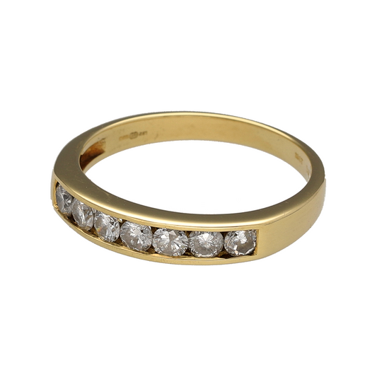 Celebrate timeless elegance and exceptional sparkle with this pre-owned 18ct yellow gold diamond seven stone band ring. Featuring seven brilliant-cut diamonds across the front of the band, this classic design is perfect for everyday luxury, special occasions, or as a meaningful anniversary gift.

Design: The ring showcases seven brilliant-cut diamonds arranged across the front of the band, creating a beautifully balanced design with impressive sparkle from every angle.