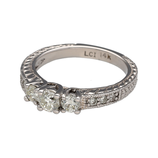 Add timeless brilliance to your jewellery collection with this pre-owned 14ct white gold diamond trilogy ring, featuring a classic three-stone design with diamond-set shoulders and beautifully patterned detailing—perfect for special occasions or everyday luxury.

Design: The ring showcases a stunning trilogy of brilliant-cut diamonds, complemented by additional diamond-set shoulders to create exceptional sparkle.