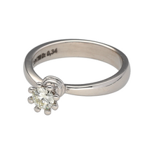 Load image into Gallery viewer, Add a touch of elegance and sparkle to your jewellery collection with this pre-owned 18ct white gold and diamond set solitaire ring.

Design: Featuring a brilliant-cut diamond set with eight proud claws, this solitaire ring offers a timeless and sophisticated look.
Material: Made from 18-carat white gold, providing a sleek and polished finish that enhances the diamond’s brilliance.
Diamond Detail: The 0.34ct diamond showcases approximate clarity of Si1 - VS2 and a colour range of K - M, creating a striking
