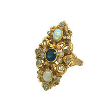 Load image into Gallery viewer, Currently the most unique ring in our collection, this piece features a unique 22ct Yellow Gold mount, intricately cradling each Opal, Diamond and Sapphire. The Opals feature in the top and bottom of the ring as well as four smaller ones surrounding the centre, all with excellent colour.
