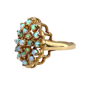 New 9ct Yellow Gold & Created Opal Flower Cluster Ring in various sizes with the weight 3.50 grams. The front of the ring is 20mm high and each stone is approximately 2mm diameter