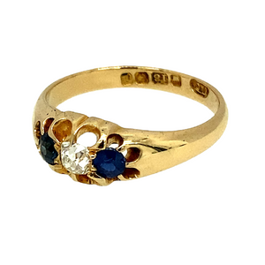 Preowned 18ct Yellow Gold Diamond & Sapphire Set Antique Ring ins ize M with the weight 3.60 grams. The ring is from the early 1900's with the date letter 1908 Birmingham. The ring contains two old cut sapphires of a bright royal blue with one old cut mine Diamond. The sapphire stone are each 3mm diameter. The Diamond is approximately coloru GF and clarity Si1 - Si2
