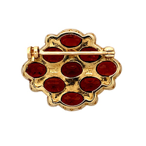 Preowned 9ct Yellow Gold Garnet & Seed Pearl Set Brooch with the weight 6.70 grams. The garnet stones are each 7mm by 5mm and the pearls are approximately between 1.5mm diameter and 2mm diameter