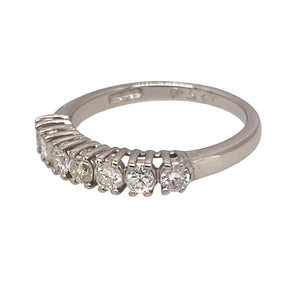 Preowned 18ct White Gold & Diamond Set Seven Stone Band Ring in size K with the weight 2.60 grams. There is approximately 50pt of Diamond content set in the 3mm band made up of seven brilliant cut Diamonds. The Diamonds are approximate clarity i1 - i2 and colour K - M