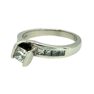 Preowned 18ct White Gold & Diamond Princess Cut Solitaire Ring in size K with the weight 4.80 grams. The center Diamond is approximately 20pt and there are eight small princess cut high set Diamonds set in the shoulders
