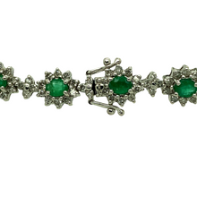 Load image into Gallery viewer, Preowned 18ct White Gold Diamond &amp; Emerald Set Bracelet with the weight 15.80 grams. The bracelet is made up of 237 small brilliant cut Diamonds in total at approximately 1.18ct - 1.25ct total. There is 17 oval cut emeralds which are 3.5mm by 4mm each
