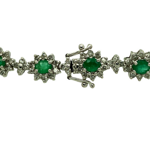 Preowned 18ct White Gold Diamond & Emerald Set Bracelet with the weight 15.80 grams. The bracelet is made up of 237 small brilliant cut Diamonds in total at approximately 1.18ct - 1.25ct total. There is 17 oval cut emeralds which are 3.5mm by 4mm each