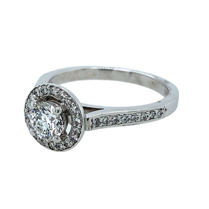 New 18ct White Gold Brilliant Cut 86pt Diamond Halo Set Ring with Diamond set shoulders with approximately G/H colour and Diamond grade Si. This ring is a size N with the weight 4.50 grams
