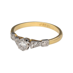Preowned 18ct Yellow Gold & Platinum Diamond Set Solitaire Ring in size I with the weight 1.90 grams. There are smaller Diamonds set in the Platinum shoulders
