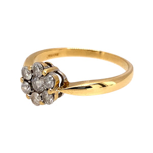 Preowned 18ct Yellow Gold & Diamond Set Flower Cluster Ring in size N with the weight 2.80 grams. There is approximately 36pt of Diamond content with approximate clarity i1 and colour M - N