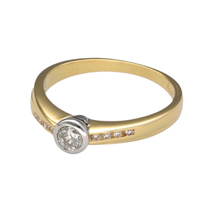 Preowned 18ct Yellow and White Gold & Diamond Set Solitaire Ring in size K with the weight 2.90 grams. The ring has Diamond set shoulders and there is approximately 25pt of Diamonds in total set in the ring. The Diamonds are approximate clarity Si2 and colour I - K