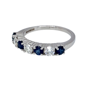Preowned 18ct White Gold Diamond & Sapphire Eternity Style Band Ring in size N with the weight 3.60 grams. There is approximately 18pt to 20pt of Diamond content in total set in three brilliant cut Diamonds. The Diamonds are all approximate clarity Si1 and colour J - K. There are three round cut sapphires at approximate size 3mm diameter each