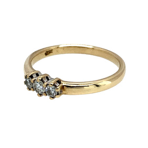 Preowned 9ct Yellow Gold & Diamond Set Trilogy Ring in size O with the weight 2.30 grams. There is approximately 25pt of Diamond content at approximate clarity Si2 and colour K - M
