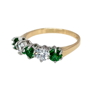 Preowned 14ct Yellow and White Gold & Green and White Cubic Zirconia Set Band Ring in size M with the weight 2.40 grams. The stones are each 4mm diameter