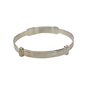 A New Silver Millgrain Edge Identity Expander Bangle with the weight 4.50 grams. The identity section is approximately 6.5mm wide and the rest of the bangle is 4mm wide. The bangle diameter is 4.1cm when closed and is 5.2cm when fully expanded