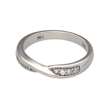 Load image into Gallery viewer, A delightful eternity ring with a crossover design, featuring a straight row of channel set Diamonds, interrupted by the White Gold band slicing through the centre of it. This creates a beautiful design that works well with most other White Gold rings, this piece is perfectly crafted to compliment other rings while maintaining some character of its own. The approximate Diamond weight of this piece is 0.15ct
